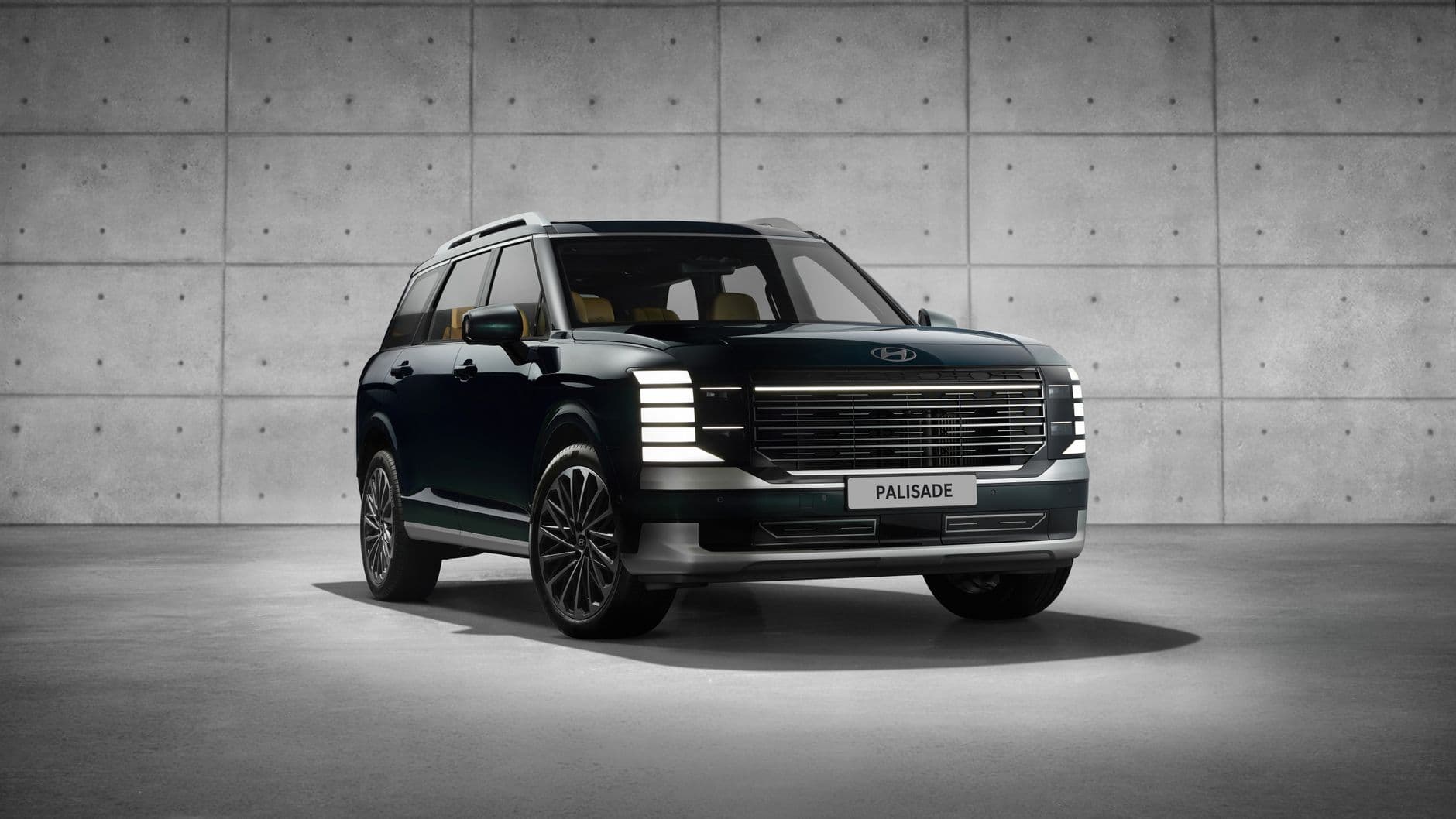 Sleek Hyundai Palisade SUV showcased in a modern indoor studio setting.